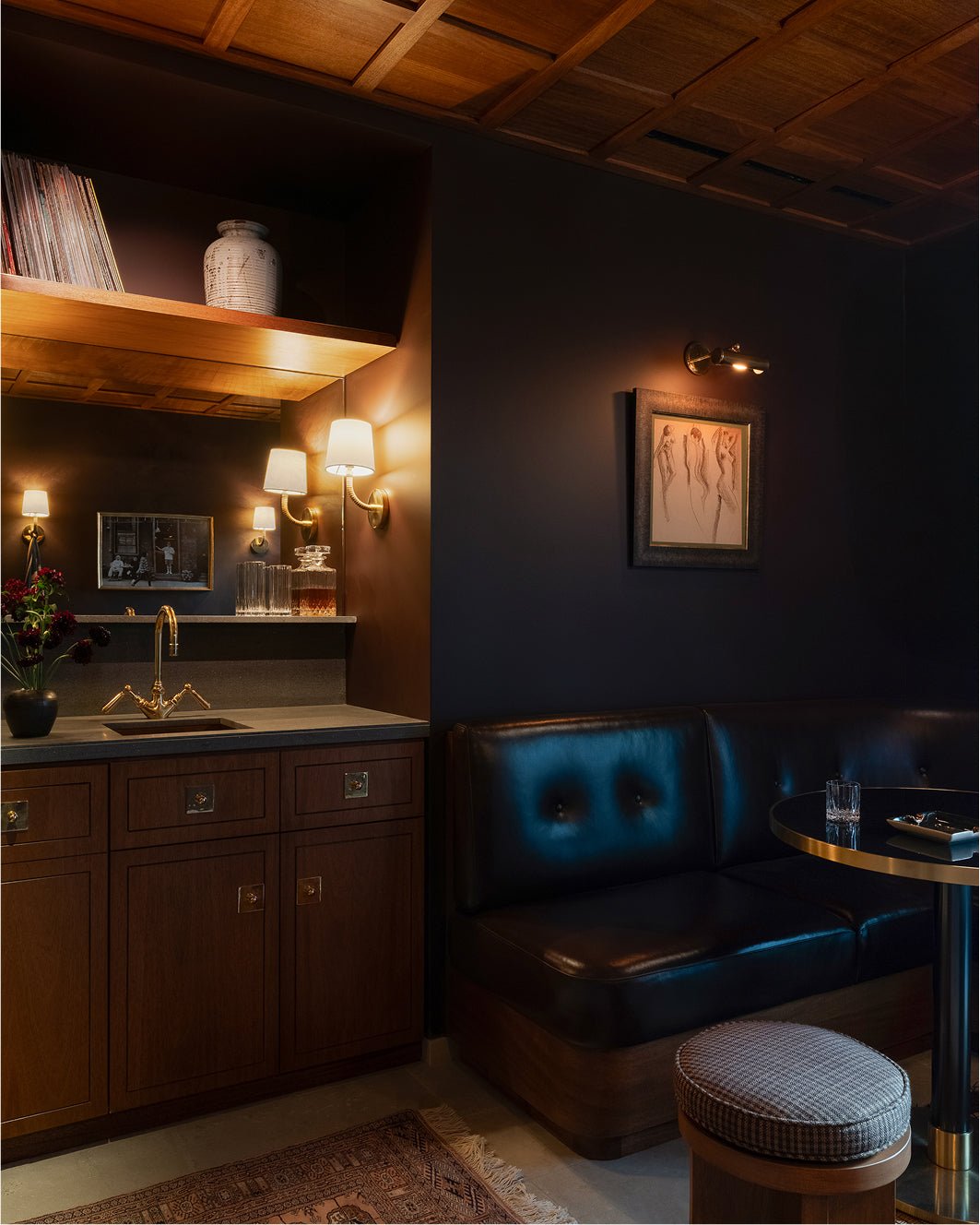 Dark interior room at Los Angeles flagship with wooden cabinets and dim lighting.