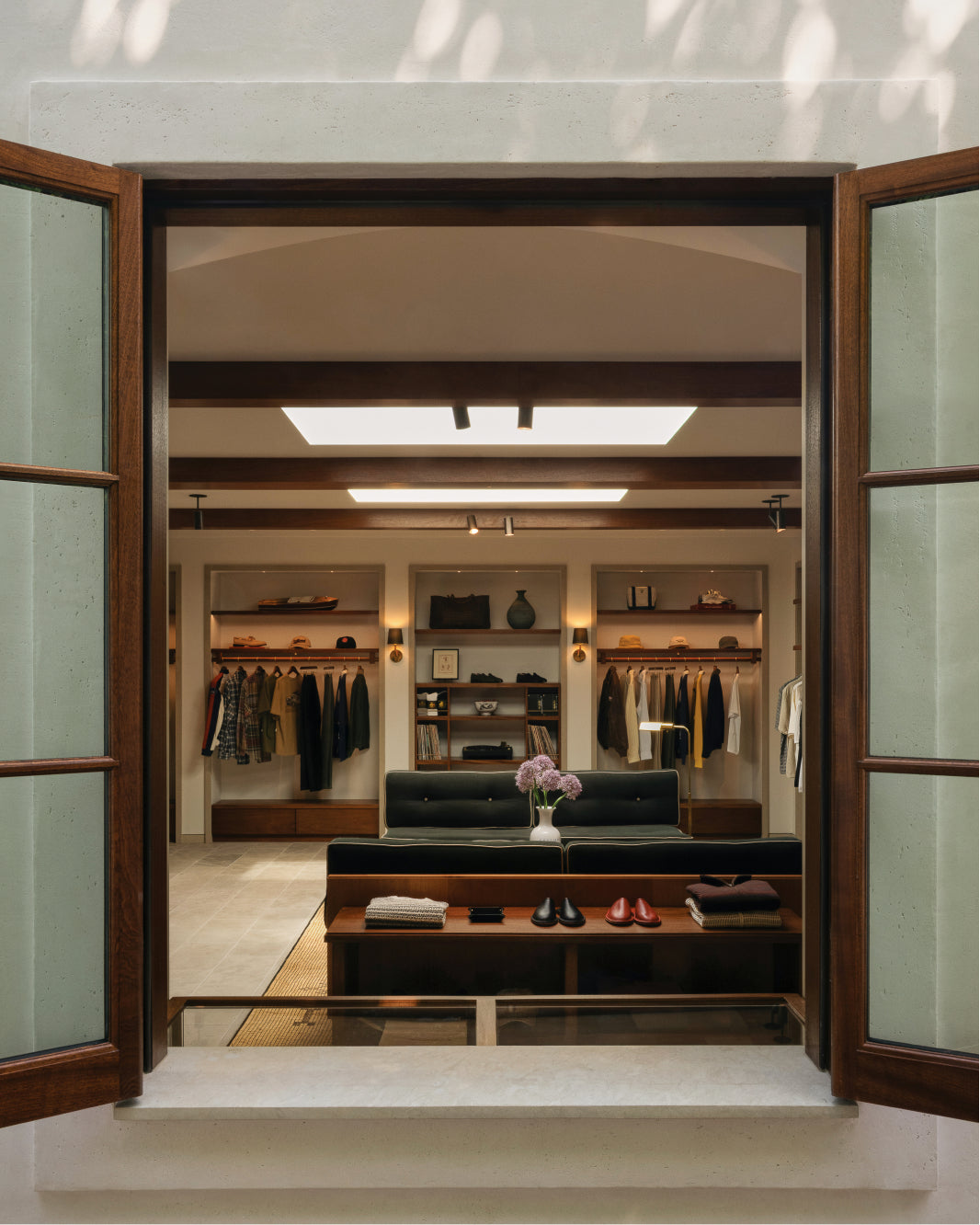 Interior of a Los Angeles flagship with windows revealing a well-organized racks and seating area.