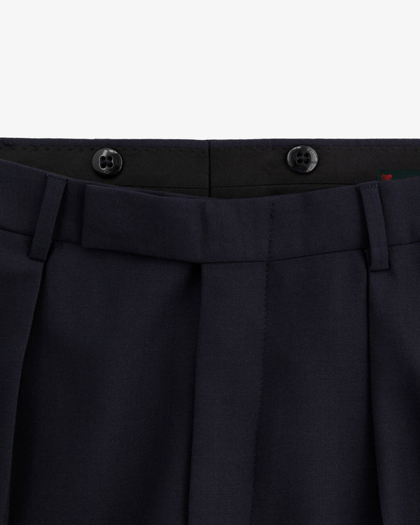 Close-up of the waistband and top front of Tropical Wool Suit Trouser in navy with belt loops and two black buttons.