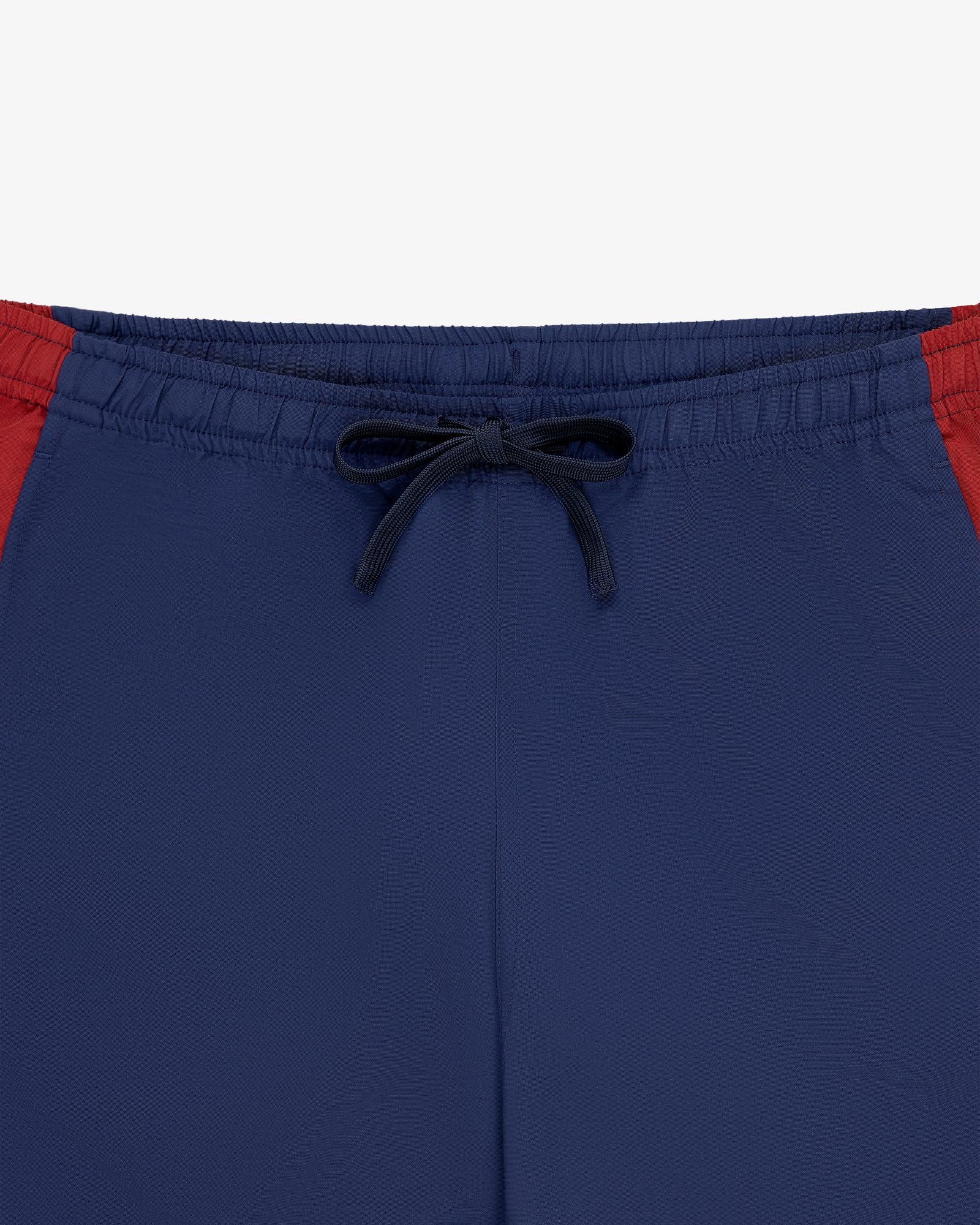 Colorblock Track Pant with black drawstring and red panels, displayed on a white background.