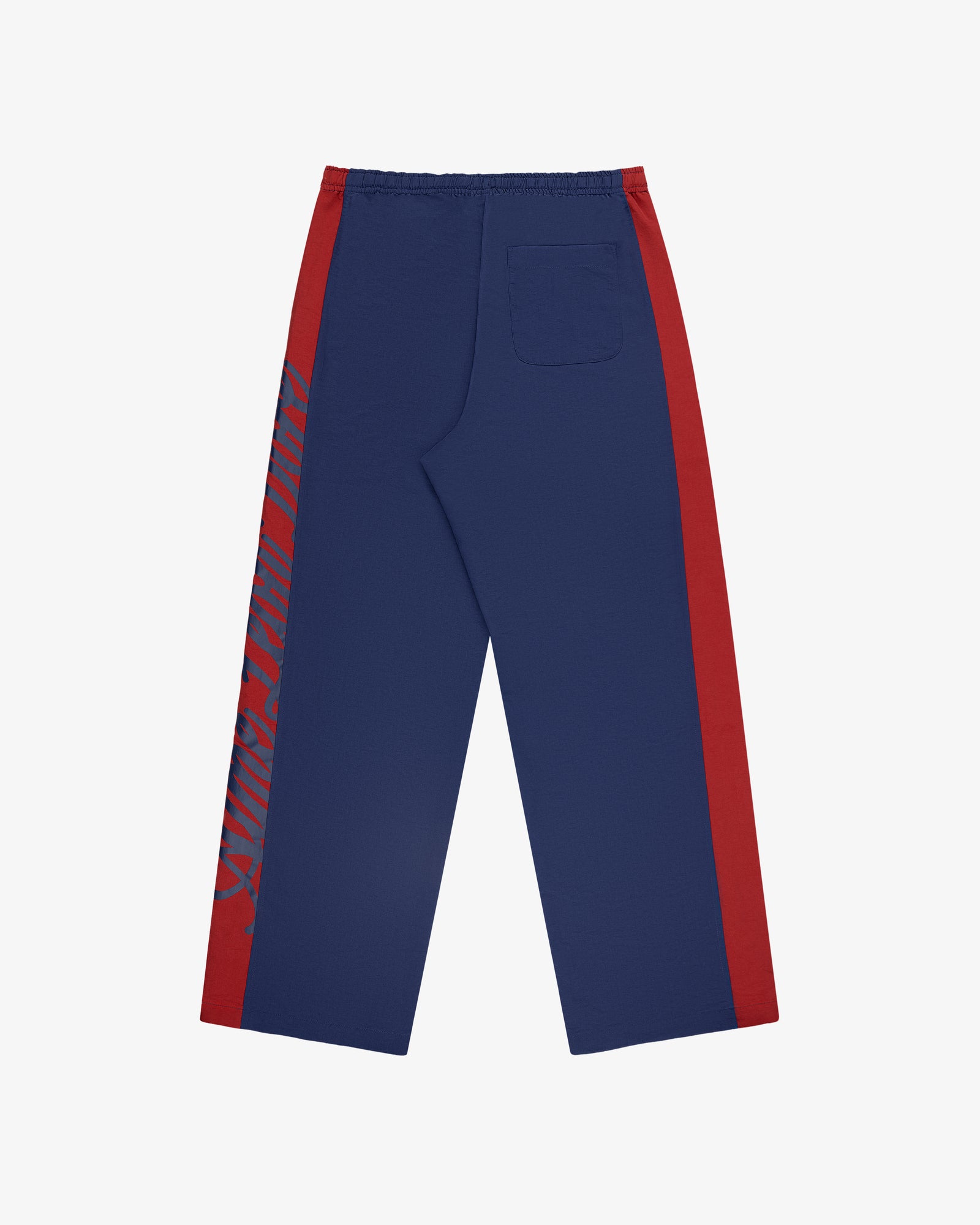 Colorblock Track Pant: navy blue with red side panels, text on left leg, back pocket; shown on white background.