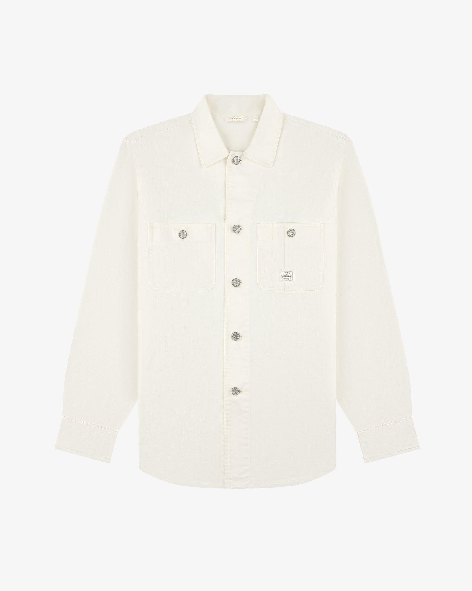 Carpenter Overshirt: long-sleeve white button-up, two chest pockets, small logo on left pocket, laid flat.