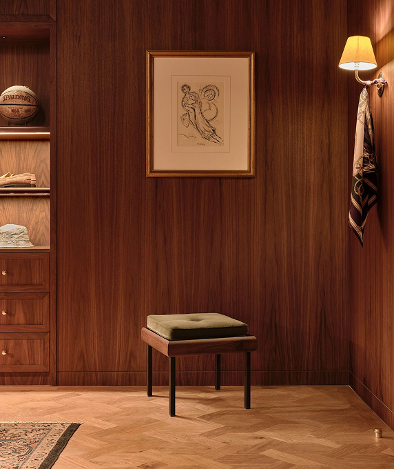 Interior corner with artwork and bench at New York Flagship
