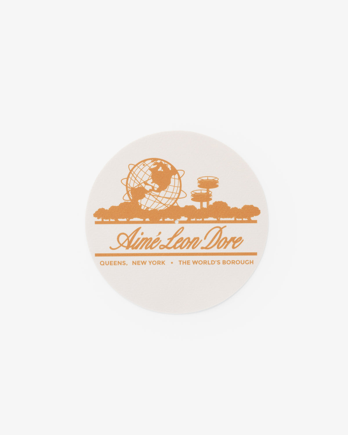Unisphere Slip Mats with orange Queens landmarks and Aimé Leon Dore text; location details underneath.
