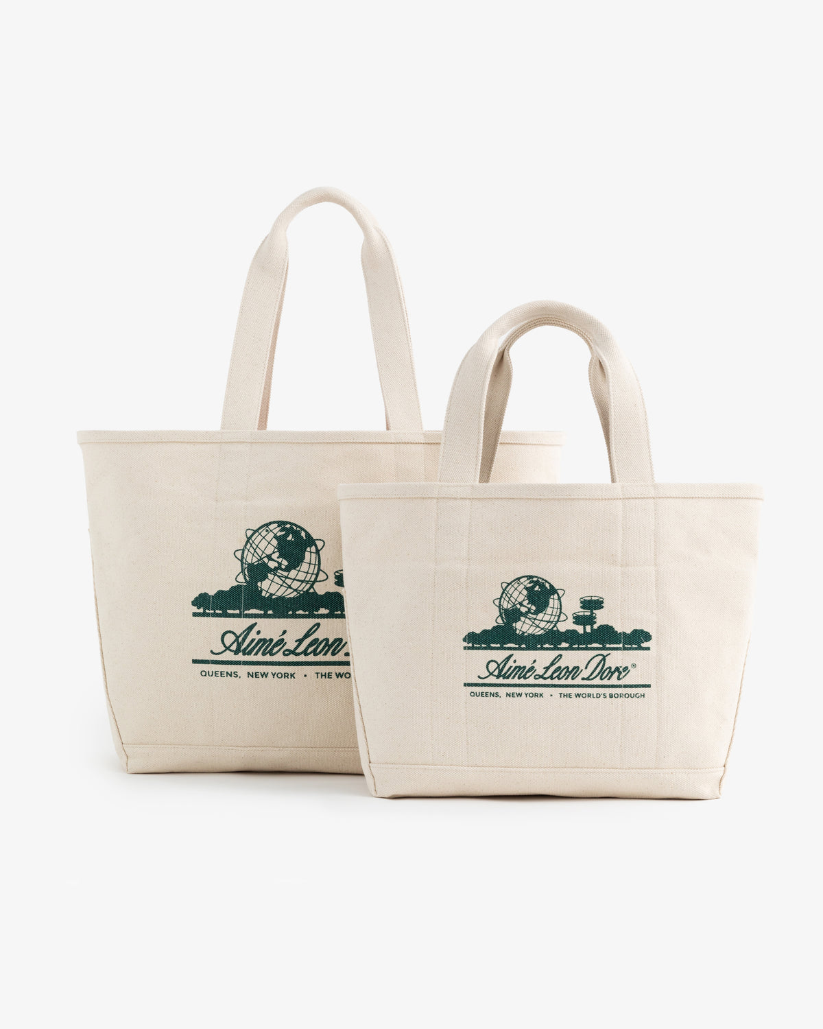 Two Large Unisphere Tote Bags, cream canvas with green graphics and short handles, displayed side by side.
