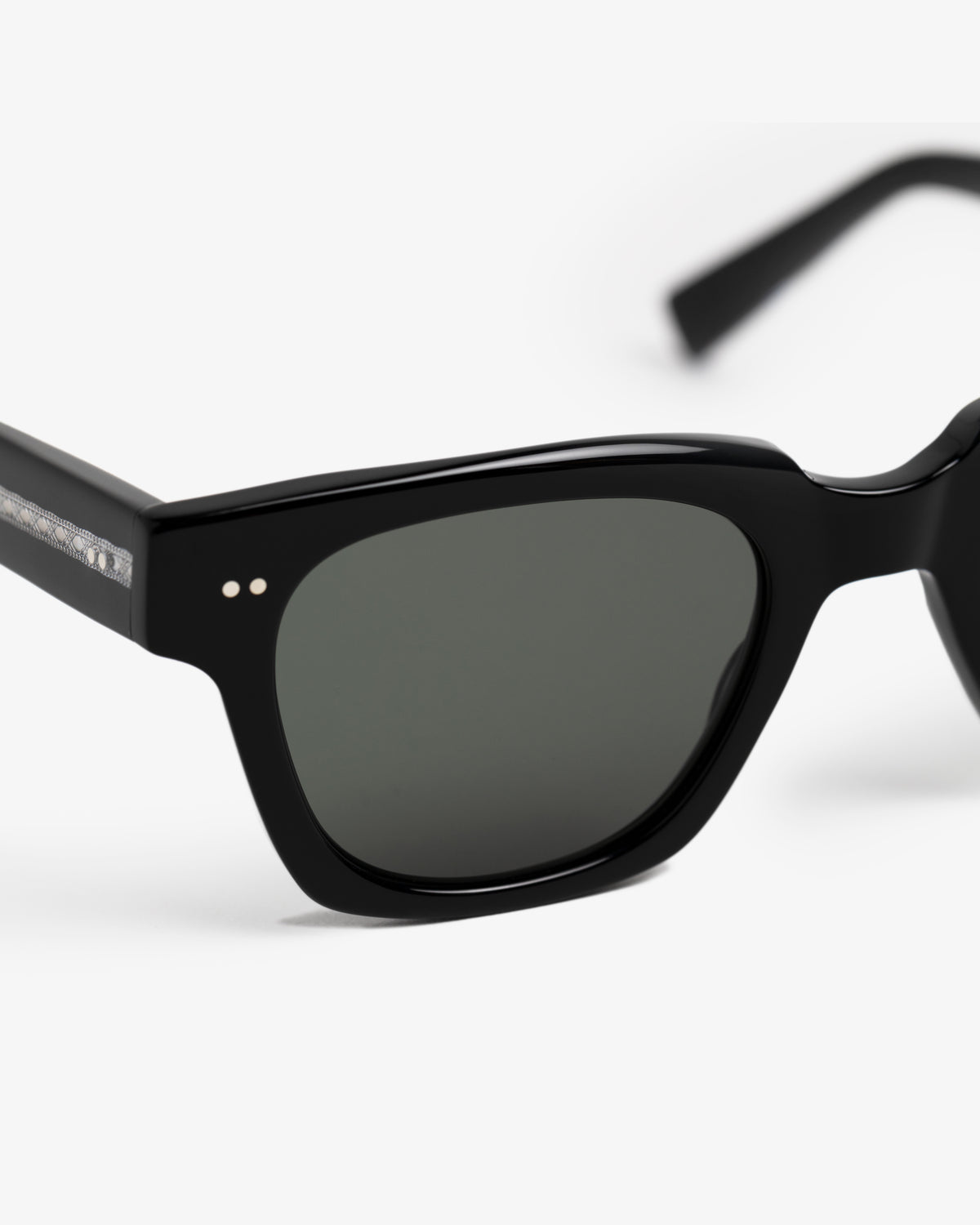 Close-up of Gallo Sunglasses with dark lenses and a sleek, glossy black frame against a white background.
