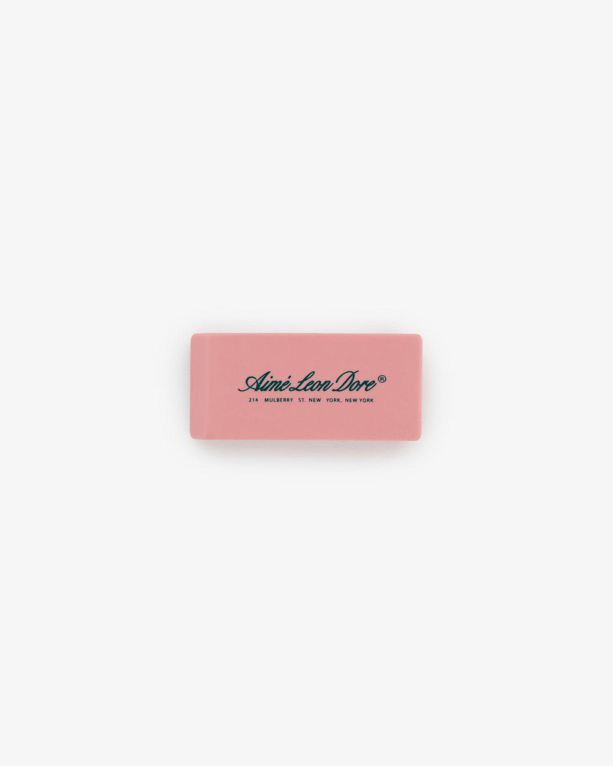 A pink rectangular Eraser 3 Pack with Aimé Leon Dore and an address printed in black on the top.