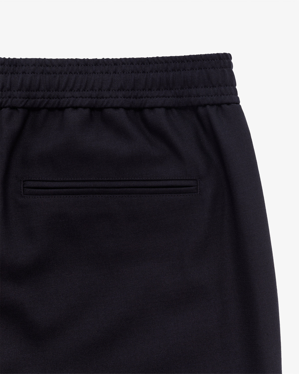 Close-up of the Tropical Wool Elasticated Waist Suit Trouser’s back, showing elastic waist and welt pocket.