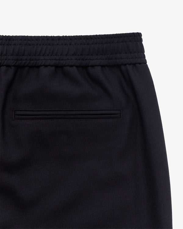 Close-up of the Tropical Wool Elasticated Waist Suit Trouser’s back, showing elastic waist and welt pocket.