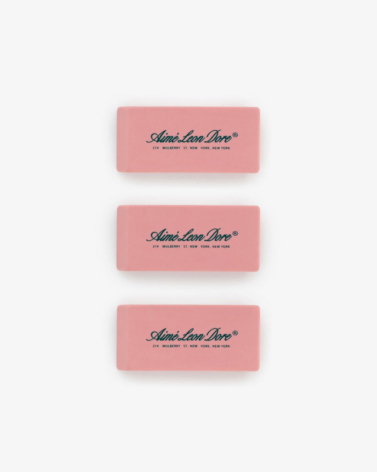 Three pink Eraser 3 Pack rectangular erasers with black Aimé Leon Dore text, arranged vertically on white.